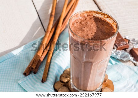 chocolate milk smoothie with banana, peanut butter and cinnamon, breakfast Royalty-Free Stock Photo #252167977