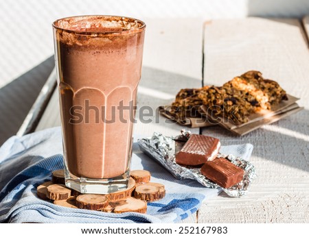 chocolate smoothie with a banana with milk in a glass, healthy food Royalty-Free Stock Photo #252167983