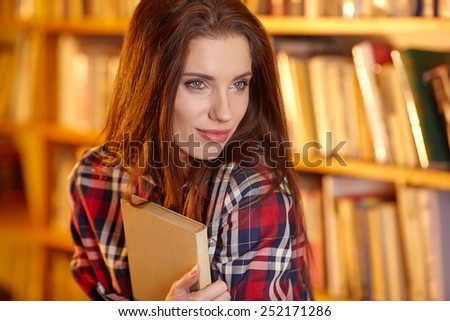 A portrait of a college student at library