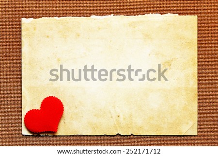 Old brown paper texture and heart decoration 