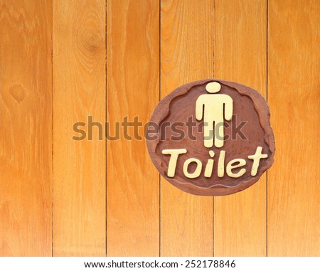  Mens toilet sign on wooden background