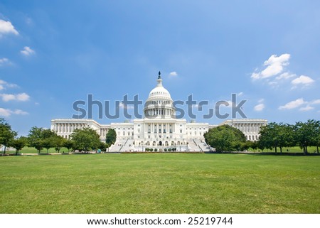 The US Capitol in summer as seen from the reflecting pool Royalty-Free Stock Photo #25219744