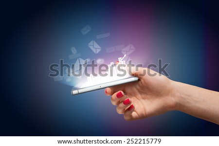 Hand with smartphone and business icons and graphic