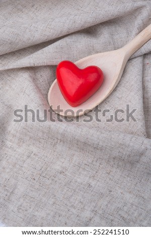 red heart in a wooden spoon