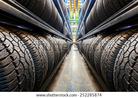 Car tires at warehouse Royalty-Free Stock Photo #252285874