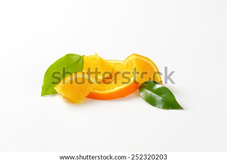 orange slices and leaves on white background