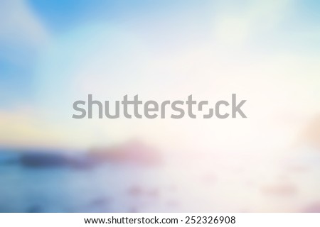 Sunny light pattern concept: Abstract blurred beach sunrise landscape background.