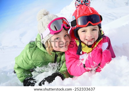 Portrait of kids enjoying winter vacation at ski resort