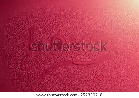 Valentine Day Love heart made by water bubbles on a red background