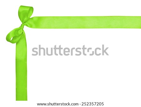 Corner for text, made of a green ribbon and a bow on the white