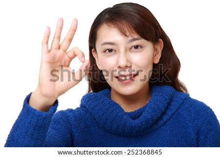 woman showing perfect sign