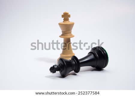 Chess pieces on a white background Royalty-Free Stock Photo #252377584