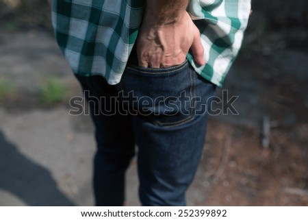 Confident man posing in selvedge  jeans