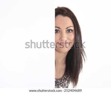 Close up woman portrait. White background female portrait. Surprised girl hold white blank card.
