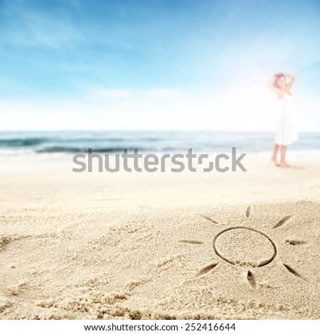 summer background with sun mark on sand and woman 