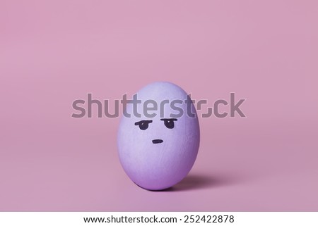 Disapproving purple painted egg
