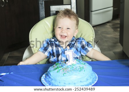 A One Year Old Boy Cake with big smile.