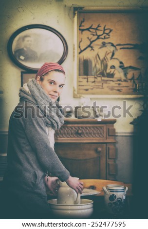 Attractive woman visiting an antique shop and looking for precious nice things, vintage style 