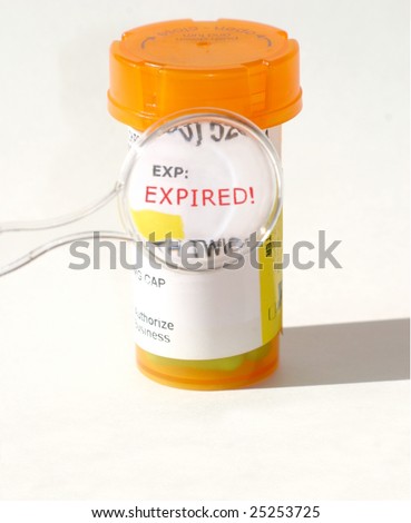 Expired bottle of prescription medicine pills that was stored for too long. Illustrating drug quality deterioration.  Royalty-Free Stock Photo #25253725