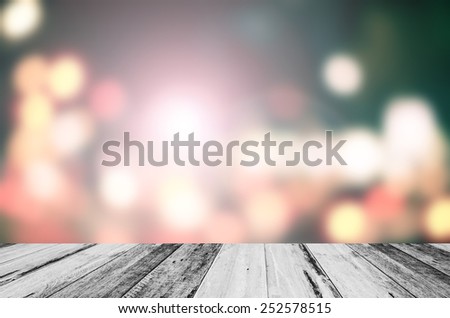 Wooden plank and abstract blurred bokeh