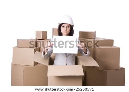 businesswoman in helmet with blank card standing in carton box