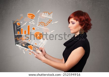 Beautiful young lady holding laptop with graphs and statistics