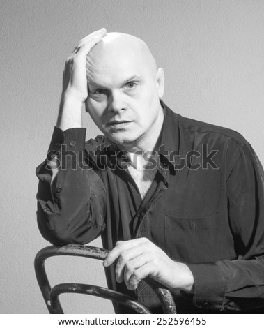 Studio black and white portrait portrait caucasian bald men. Emotions. Upset