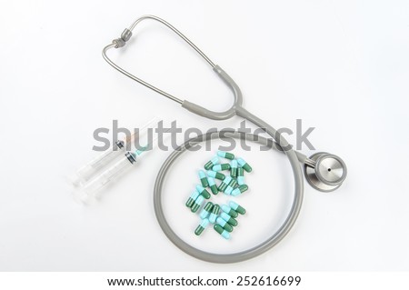 Stethoscope with pill Royalty-Free Stock Photo #252616699
