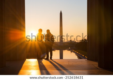 Washington D.C. - Sunrise at Lincoln Memorial with silhouettes of Capitol Building and Washington Monument 