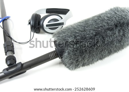 boom mic and headphones over white