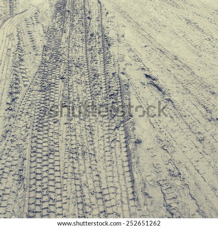 Close up View of Tire Tracks Prints in Sand, Vintage toning