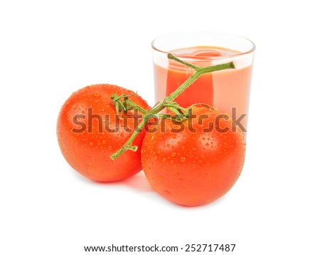 The glass with tomato juice and three tomatoes is isolated on white 