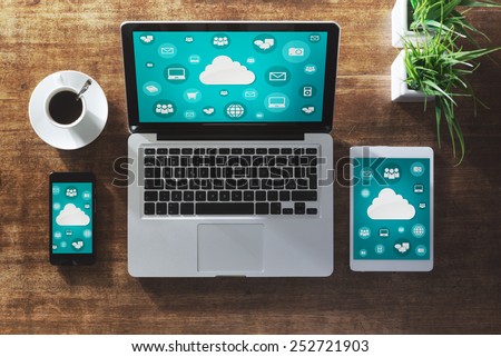 Cloud computing and social network interface on a laptop, tablet and smartphone screen