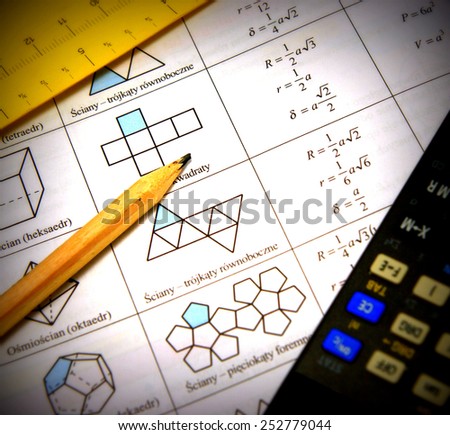 Polygons theory illustration: mathematics book, measurement, glasses, calculator and pencil - center focus