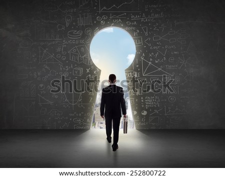 Business man looking at keyhole with bright cityscape concept background