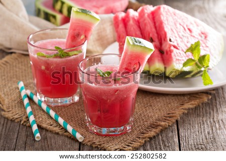 Watermelon drink in glasses with slices of watermelon Royalty-Free Stock Photo #252802582
