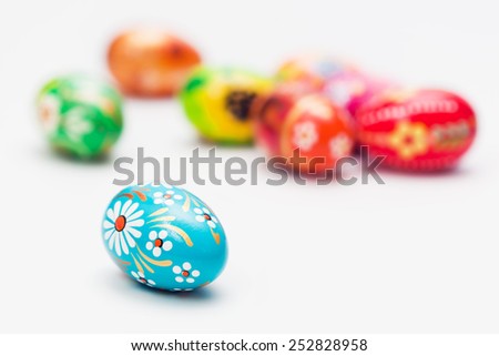 Handmade Easter eggs isolated on white. Floral, colorful spring patterns and designs. Traditional, artistic and unique.