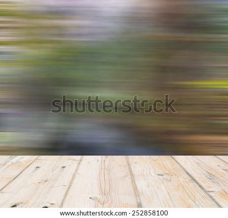 blurry landscape with old wooden floor on foreground