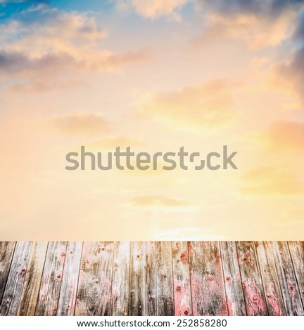 Sunset Sky background with old wooden table