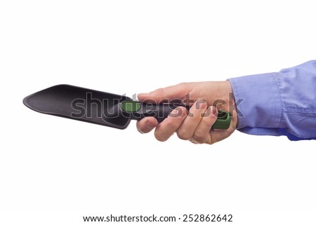 Male worker's hand holding plastic garden trowel. Part of series set of images with DIY tools for home jobs and crafts in hand isolated on white background.