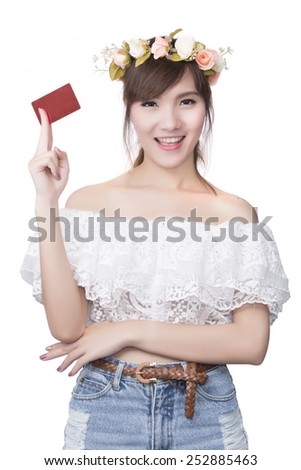 A beautiful woman holds out a business or credit card Isolated o