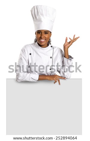 Happy woman cook or baker holding over paper sign billboard. 