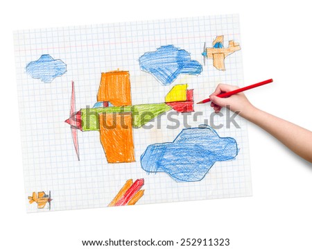 airplane on checkered paper. children drawing hand with crayon.