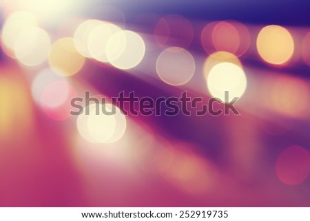 Defocused abstract lights background in motion blur.