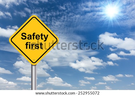 safety first sign banner and clouds blue sky background