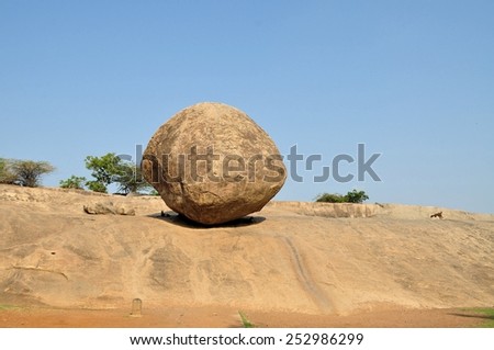 Krishna's butterball balancing giant rock, India Royalty-Free Stock Photo #252986299