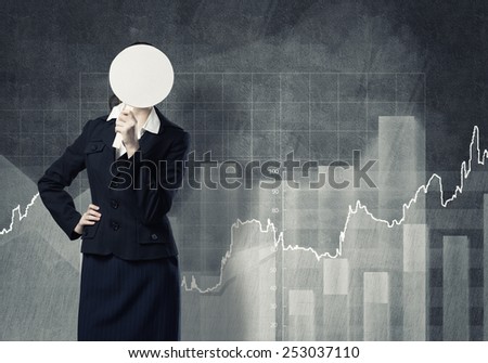 Businesswoman and graphs at background hiding her face behind mask