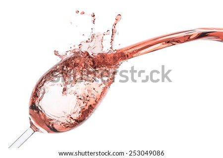 rose wine splashing on white background Royalty-Free Stock Photo #253049086