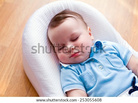 baby is sleeping in his cradle at home