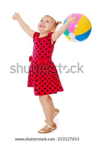 the joy of a little girl raised her hands up playing ball.Isolated on white.